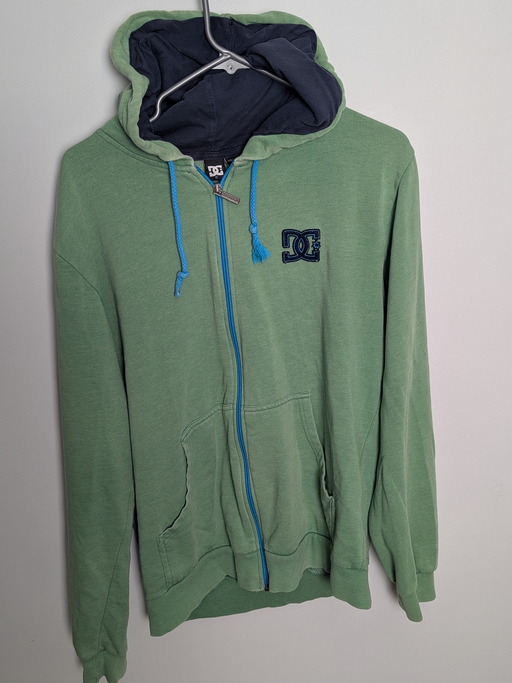 DC Light Green Zip-Up Hoodie with Navy Lining and Bright Blue Trim